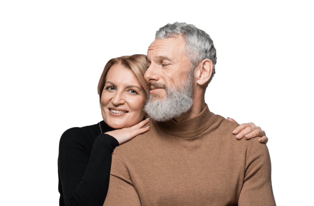 A woman holding a man whilst looking happy